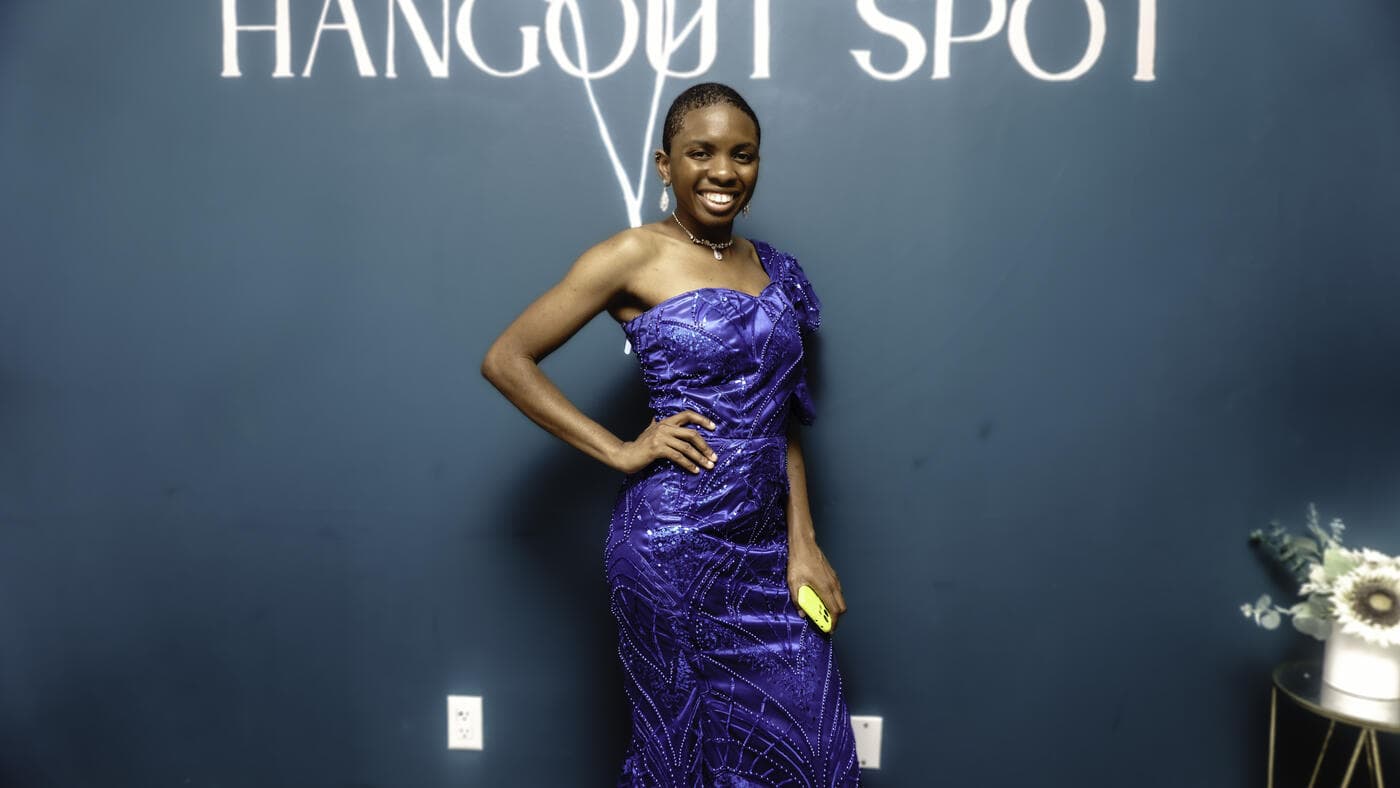 A guest in a royal blue gown at Gala Night