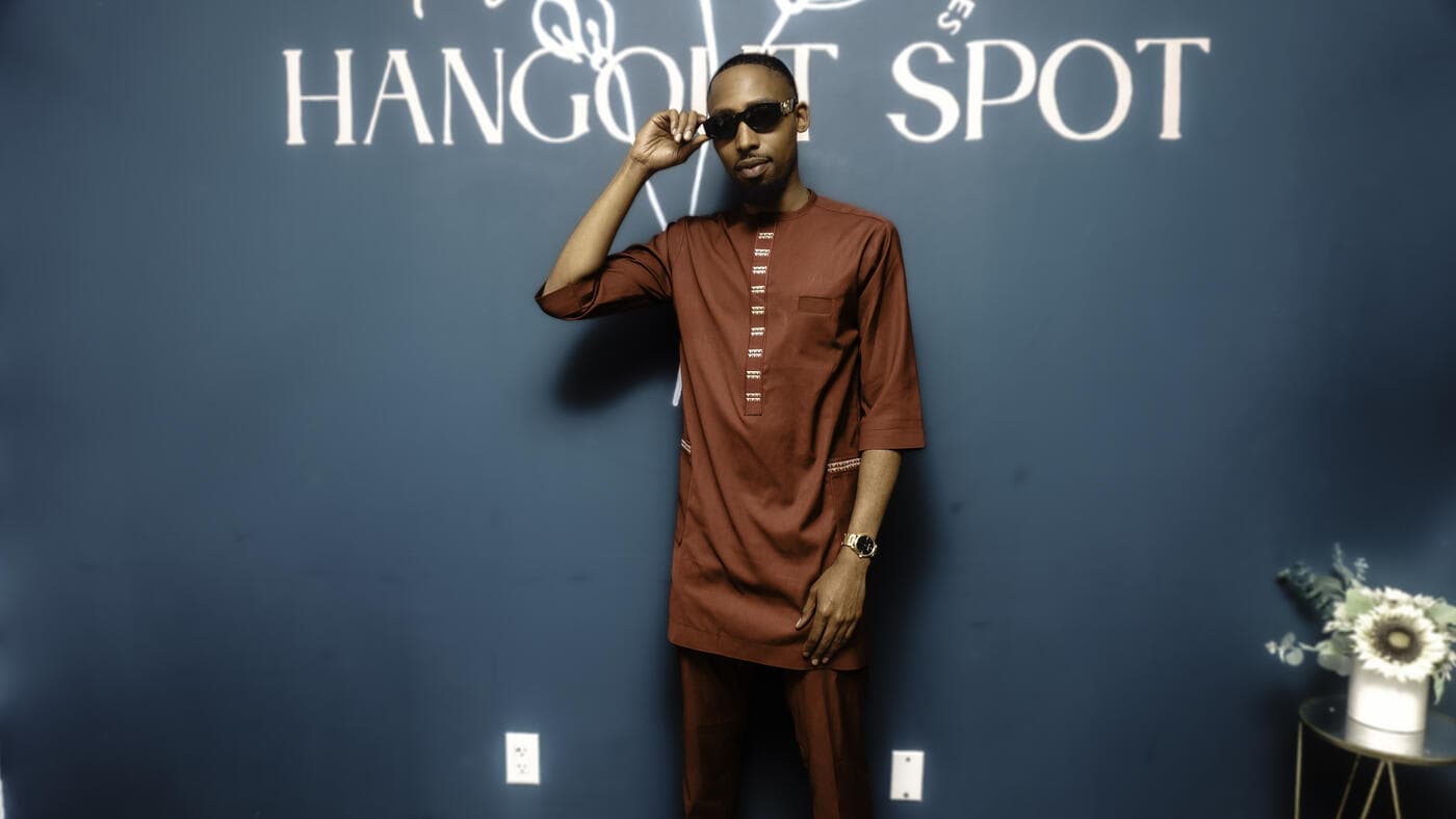 A guest in a red kaftan at Gala Night