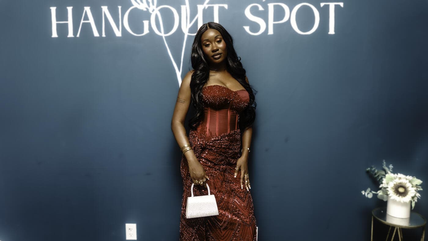 A guest in a red lace dress at Gala Night