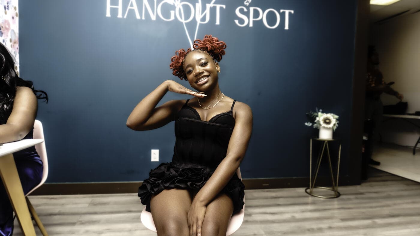 A guest seated and smiling at Gala Night
