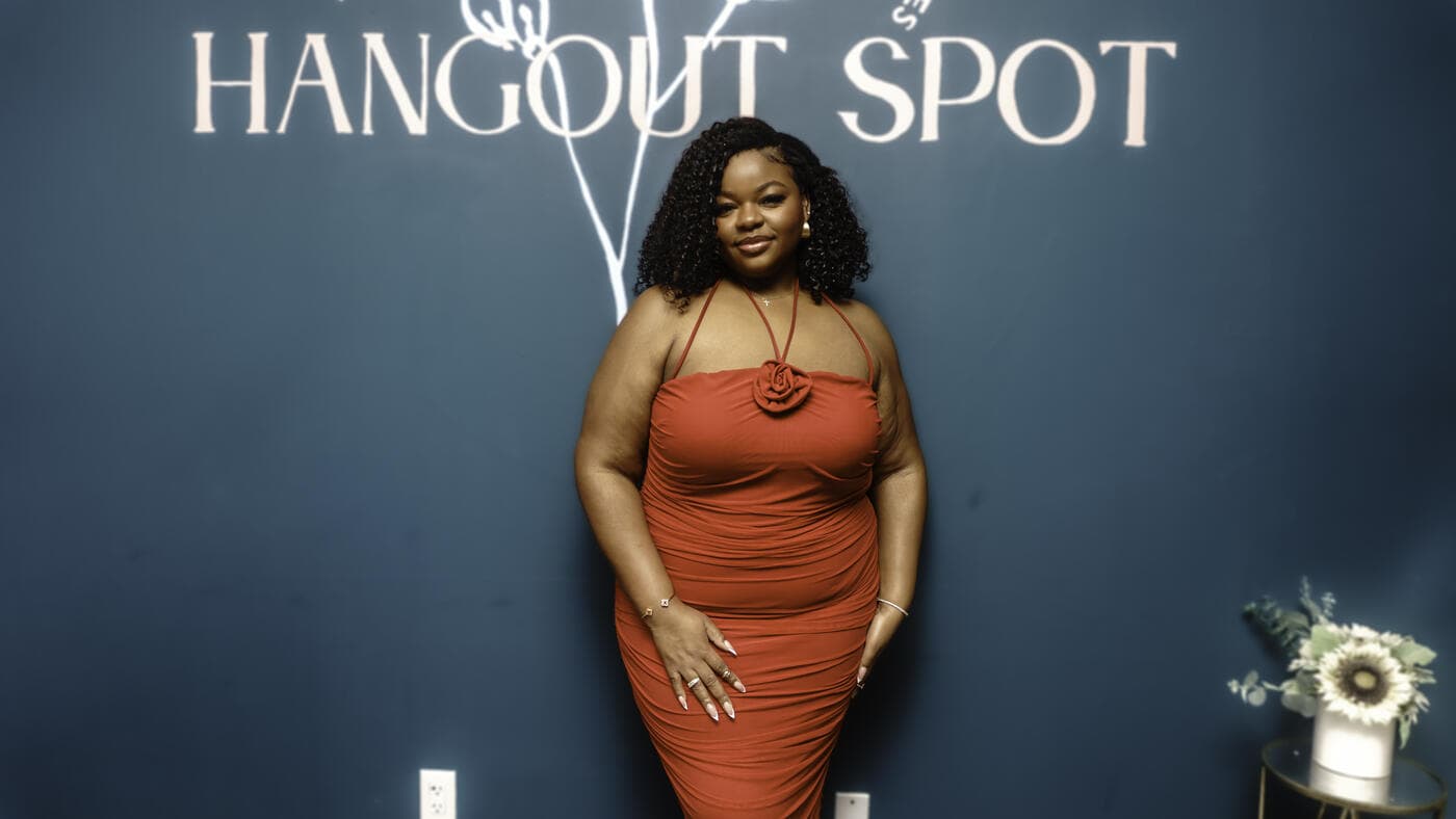 A guest in an orange dress at Gala Night
