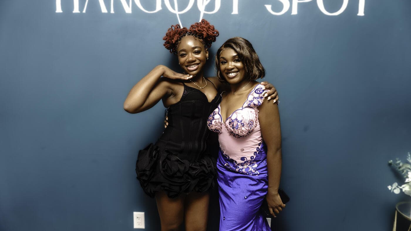 Two friends smiling together at Gala Night